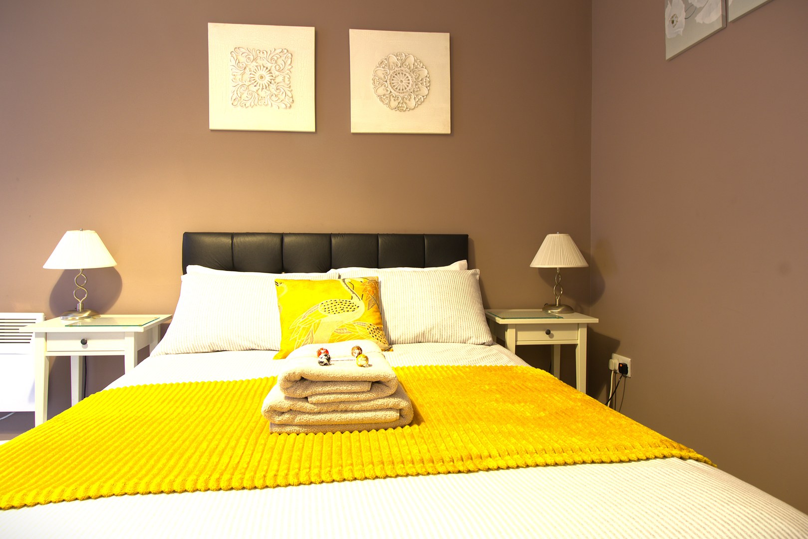 The Savile — luxury bedroom with mustard throw